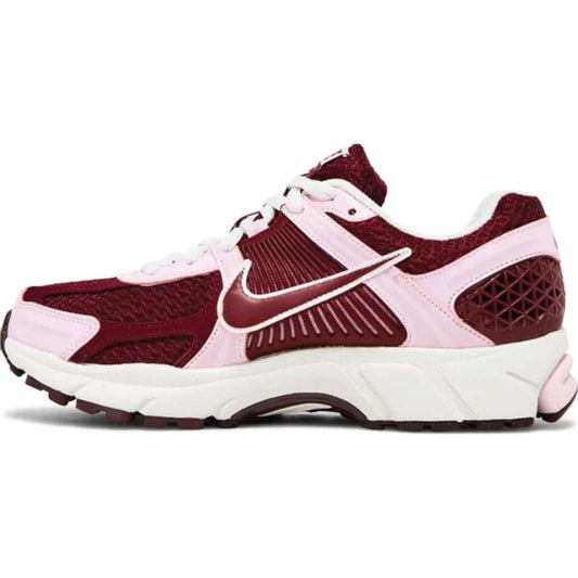 This is the left side shoe of Wmns Air Zoom Vomero 5 'Pink Foam Team Red'.
